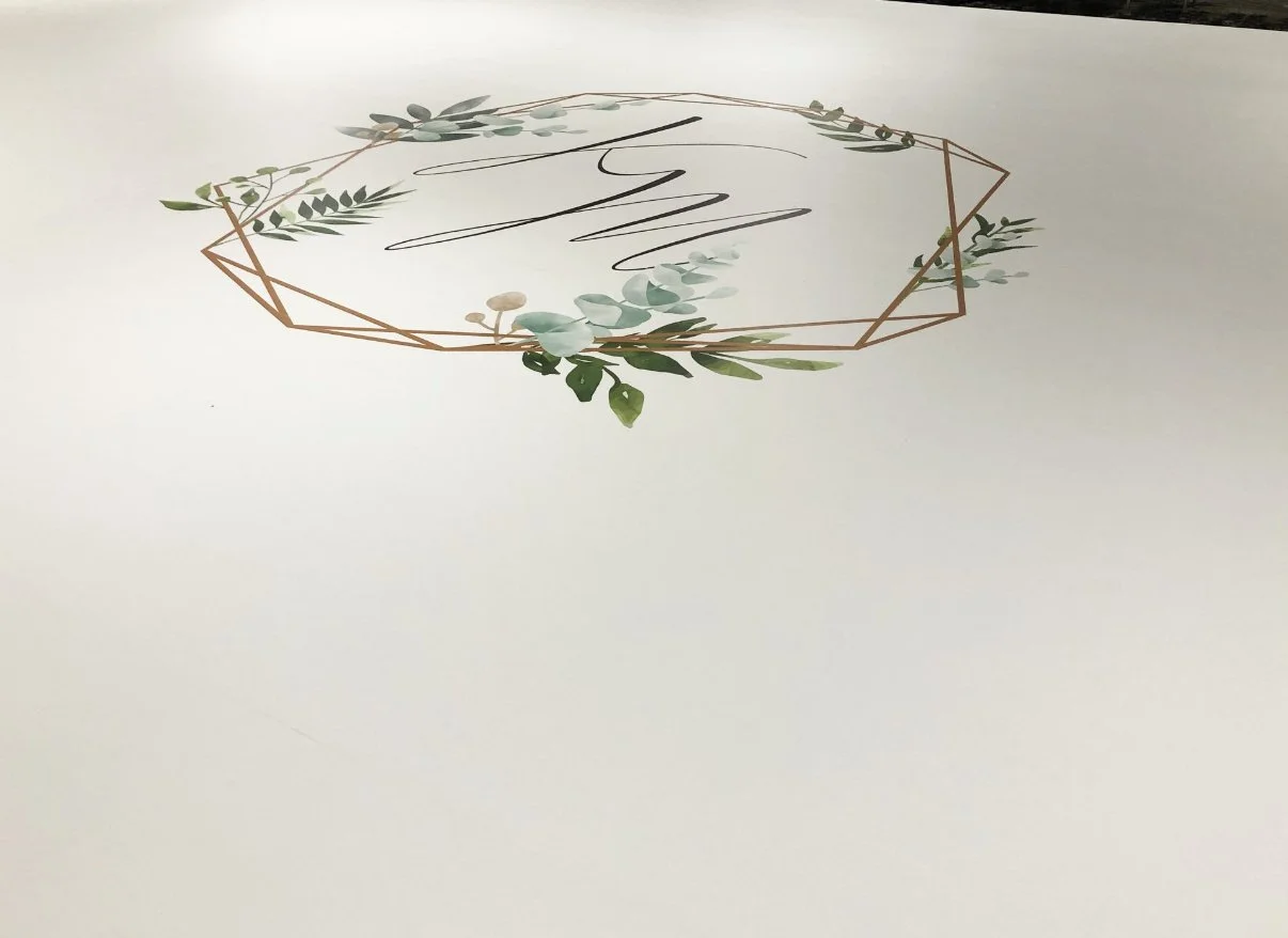 Greenery-framed monogram floor decal