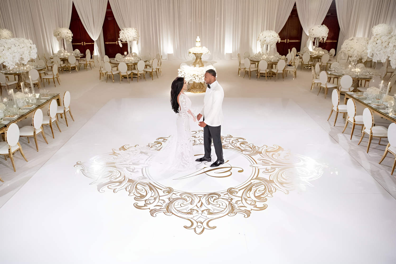Couple's first dance on an ornate monogram floor